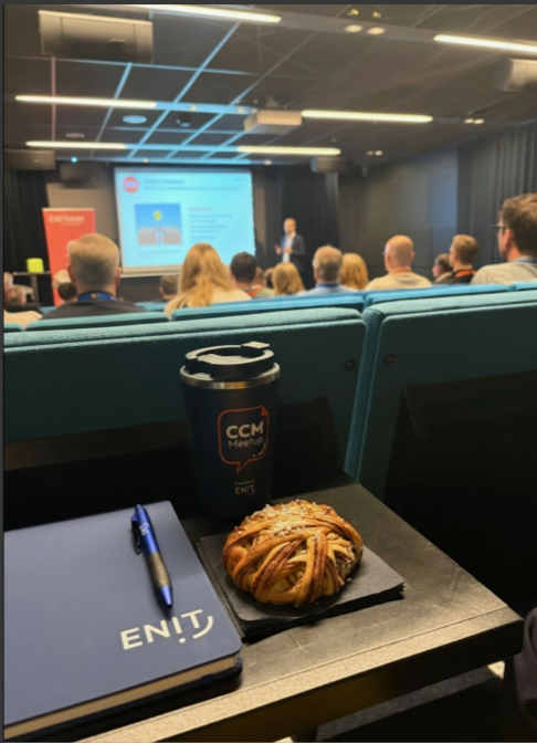 Thermos mug with the ENIT logo on it.